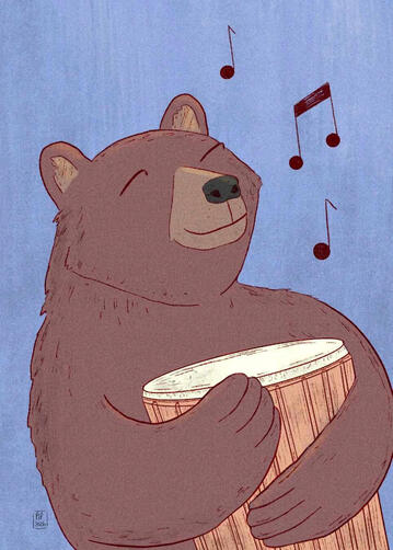 A bear hugs a hand drum and looks very happy