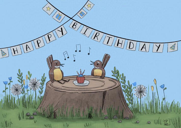 Two fantails sit at a tree stump. There is a muffin with candles in it which sits on top of the stump. A banner reading happy birthday is in the background.